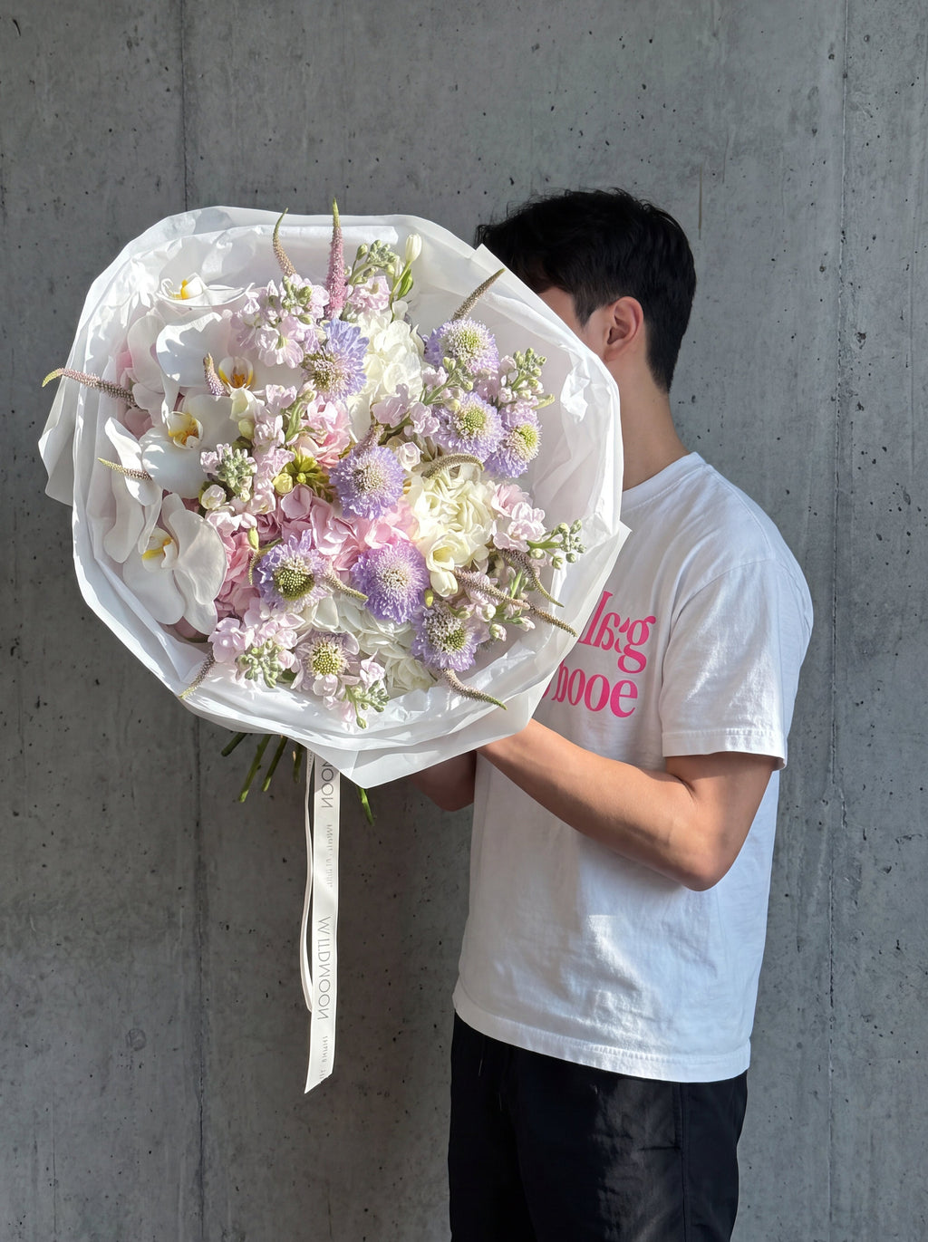 Moonlight Blush, detail view 2. Blush and white bouquet with O'Hara roses, hydrangea and phalaenopsis orchid.