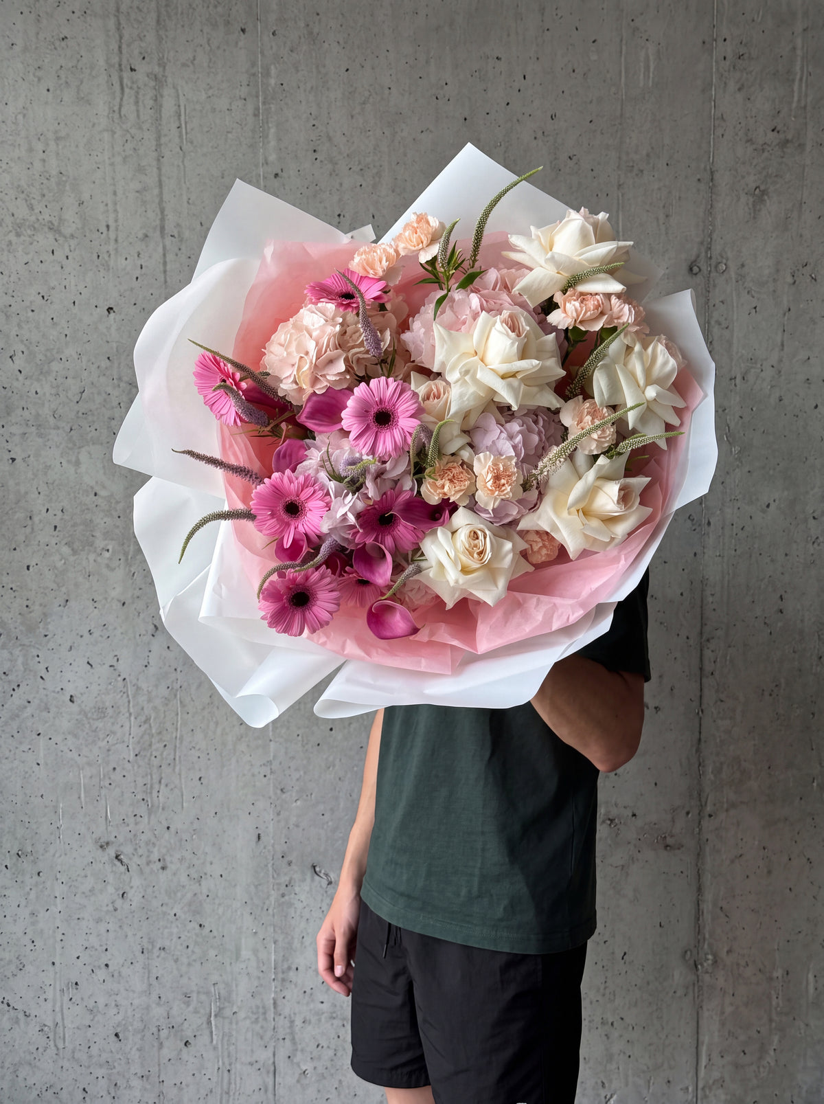 Pink Voltage, detail view 4. Bold pink bouquet with French garden roses, ranunculus and gerbera.