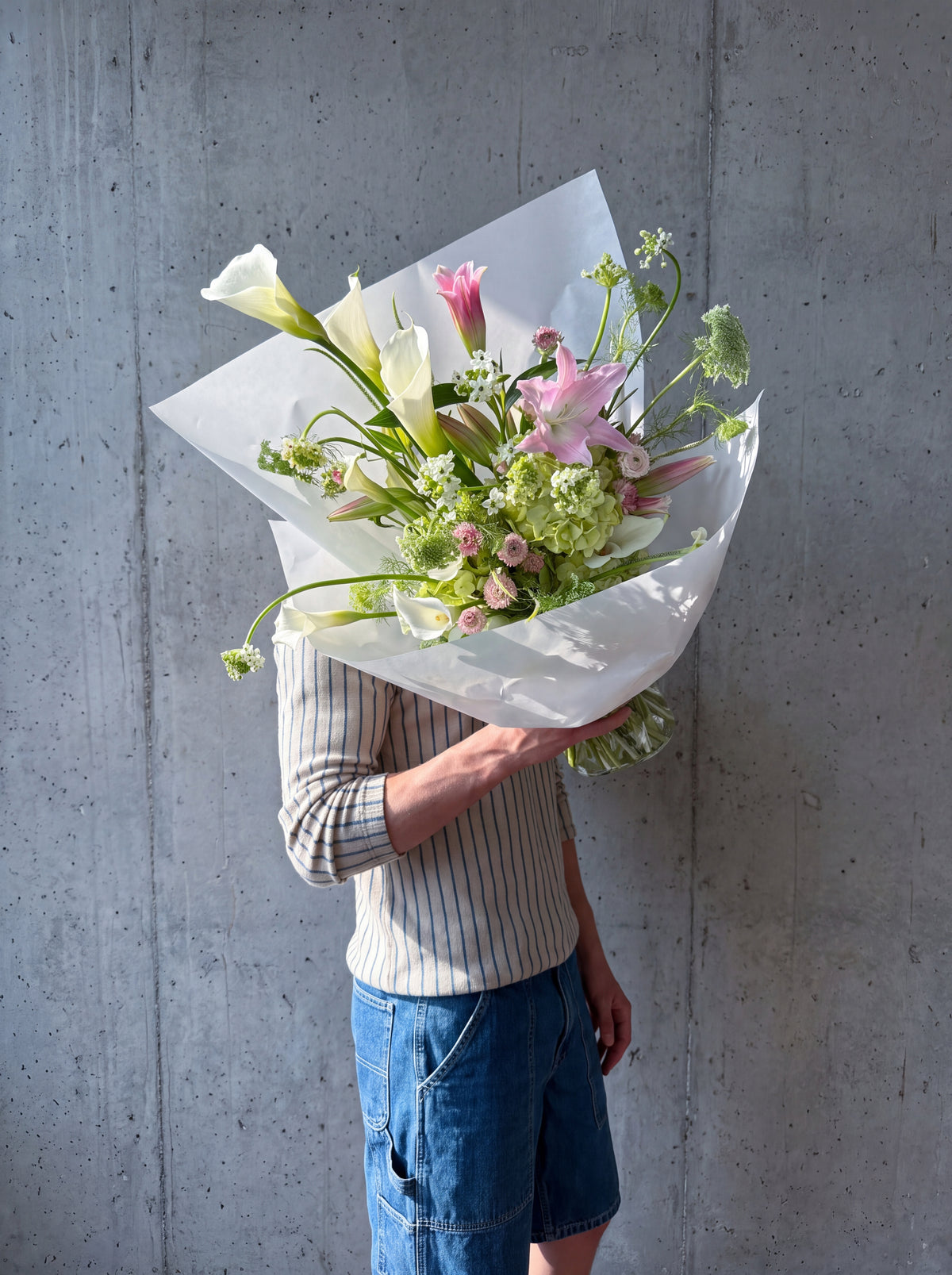 Calla Me Maybe by WildMoon Flowers, Toronto. Airy sculptural bouquet built around statement calla lilies and green hydrangea.