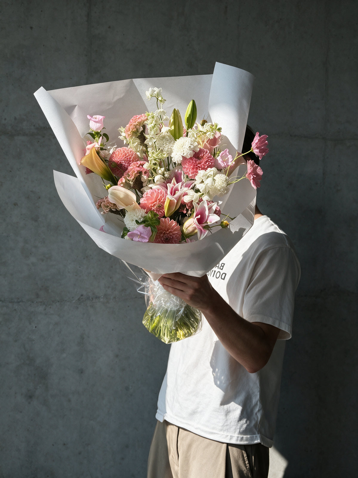 PINK NOISE by WildMoon Flowers, Toronto. Sculptural pink and white bouquet with calla lilies and seasonal dahlias.