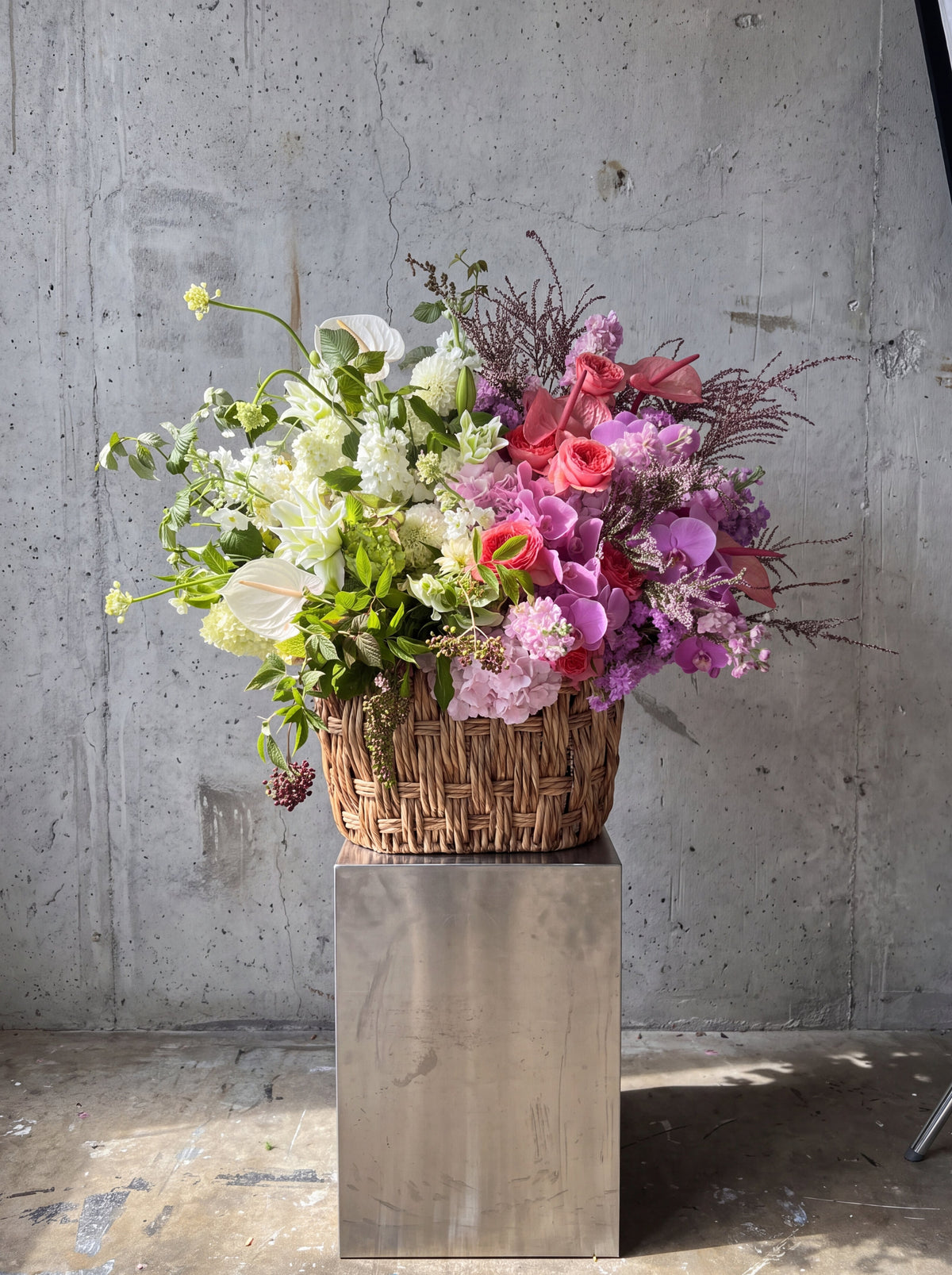 Yin-Yang Garden Basket by WildMoon Flowers, Toronto. Sculptural garden basket with orchids, garden roses and hydrangea.